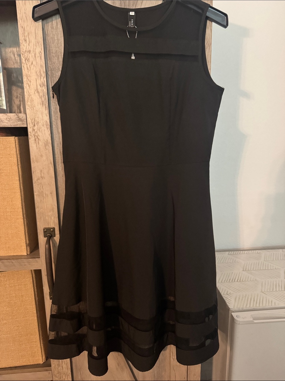Sleeveless Black Midi Dress with Sheer Panel Accents